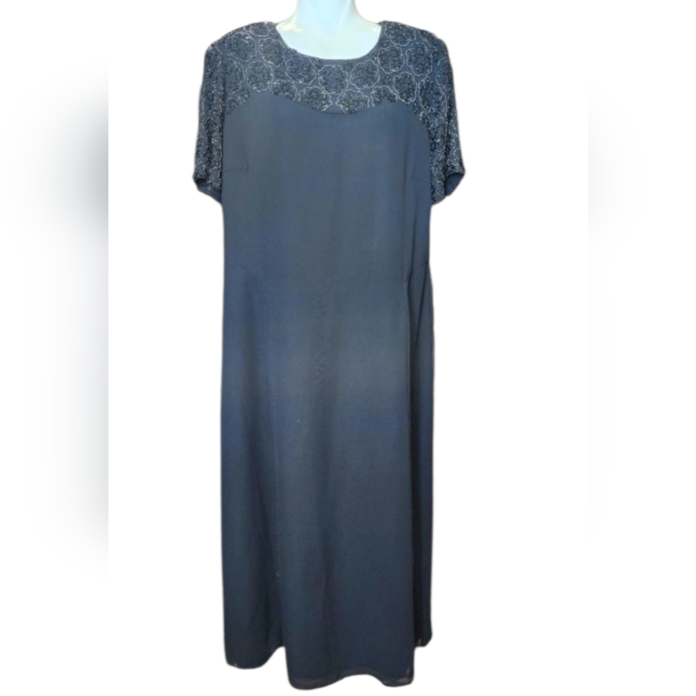 Talbot Black dress with stones on all the sleeves and shoulders in the shape of
